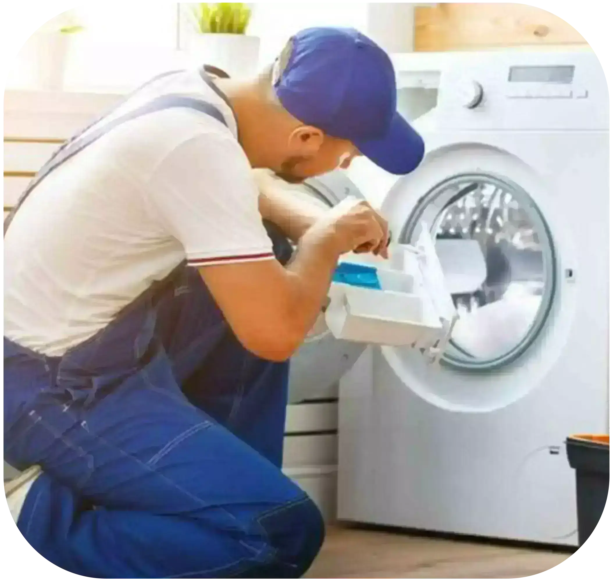 The guy is repairing the washing machine.